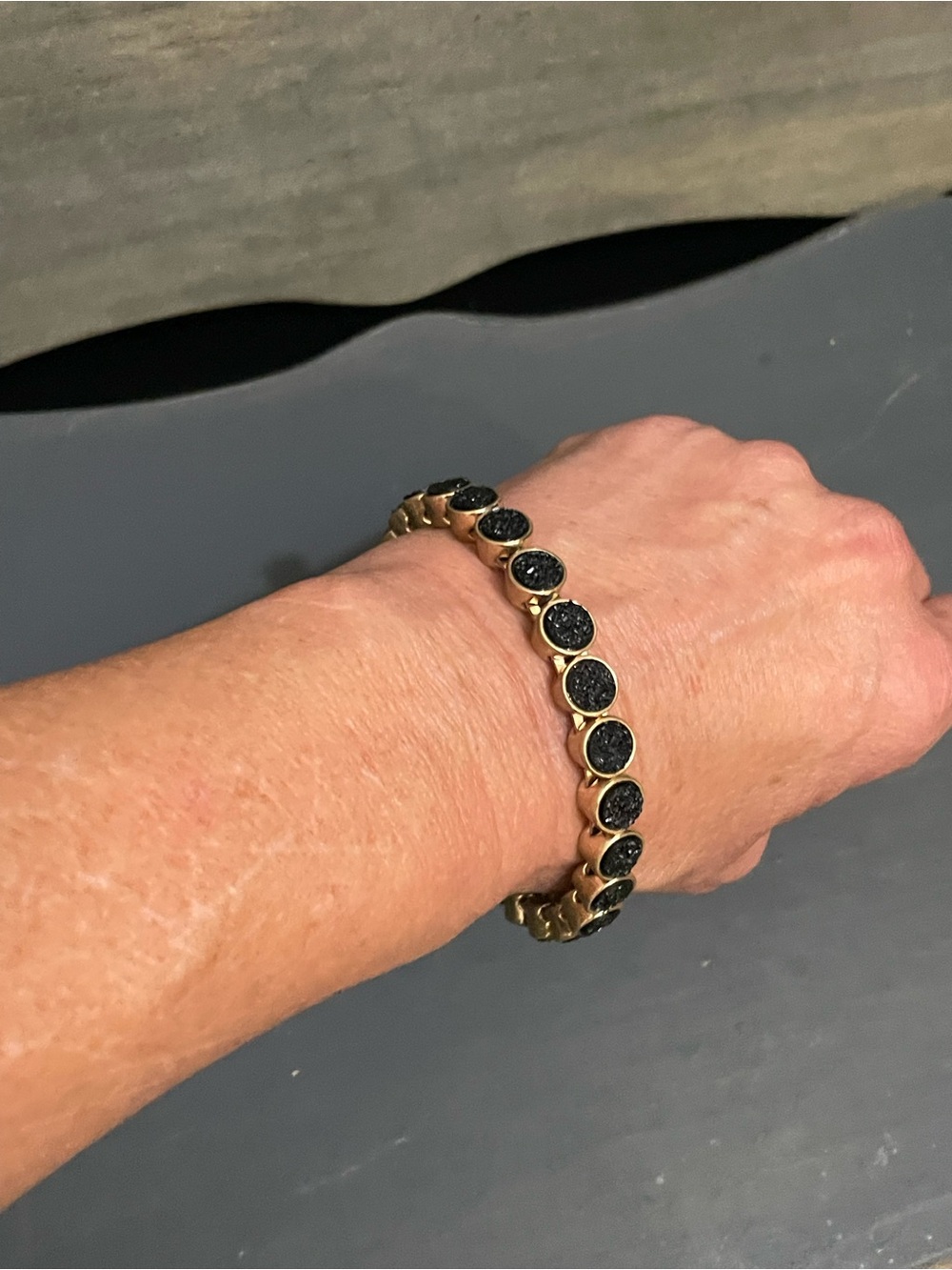 Gold-Tone Bracelet with Black Disc Accents